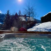 The chalet is blessed with a large sunny deck, and a hot tub ready to plunge into