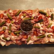 Enjoy a delicious charcuterie board alongside warming tartiflette